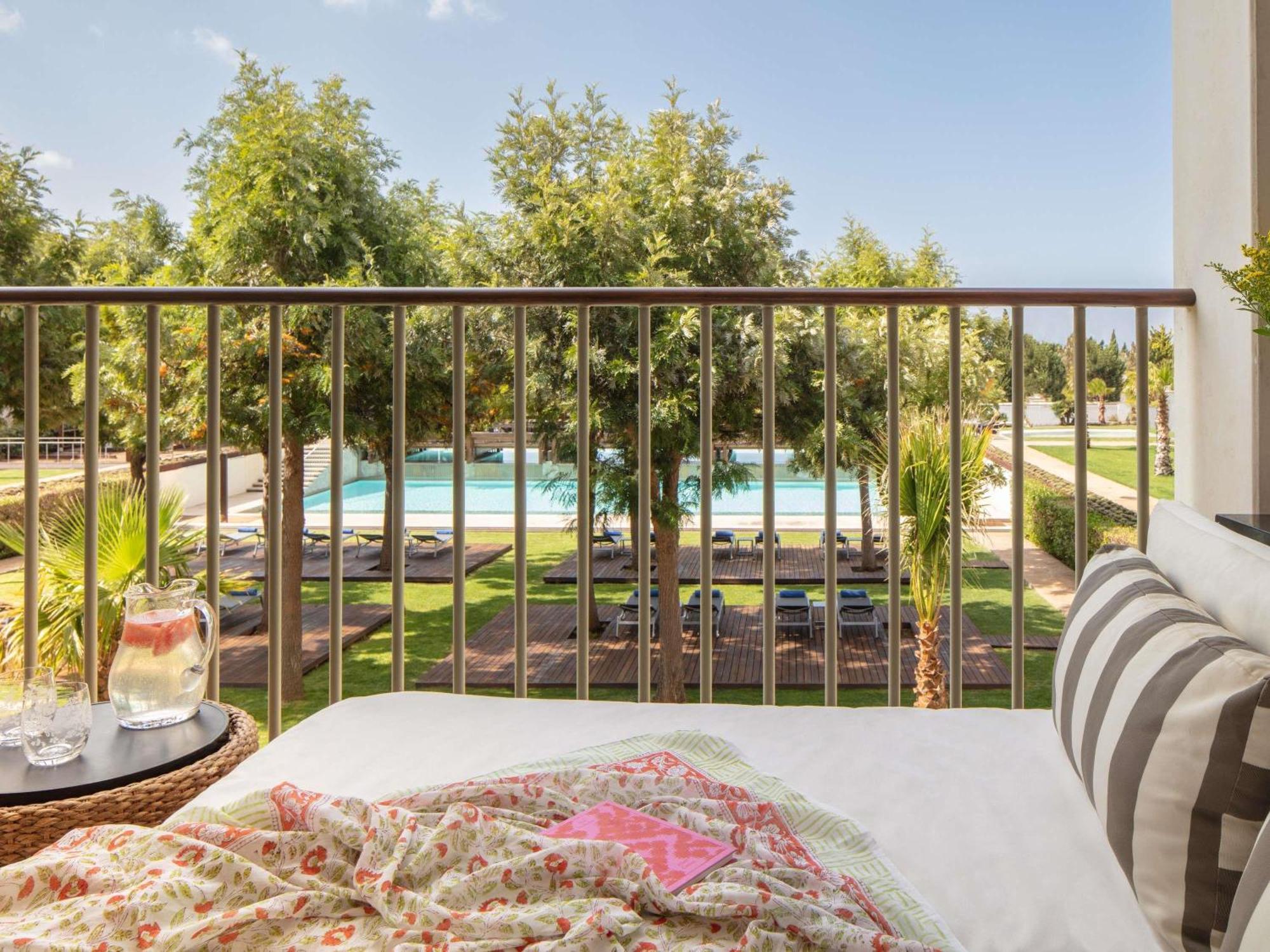 Deluxe King Room balcony pool view